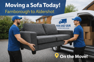 Two professional movers carrying a sofa during a man and van job from Farnborough to Aldershot